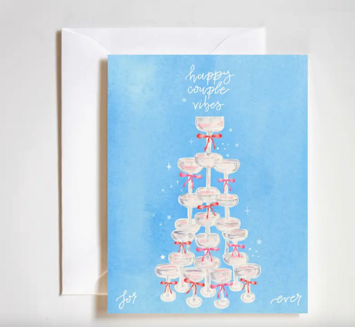 Greeting card with a tower of glasses and 'happy couple vibes' text on a blue background