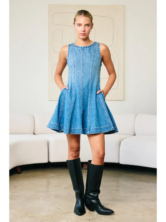 "Fall Layers Favorite" – Denim dress styled with a cream turtleneck and ankle boots

"Pocket Full of Pretty" – Close-up of side pocket detail on flared denim skirt

"Zip & Twirl" – Back view showcasing the zipper and flowy silhouette in motion