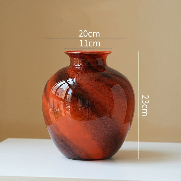 Clear lustrous glass vase with smooth polished finish and wide opening for floral arrangements