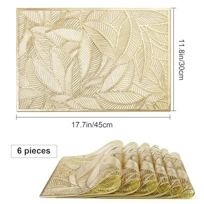 Golden rectangle table mat with hollow leaf design made of PVC and vinyl on a dining table