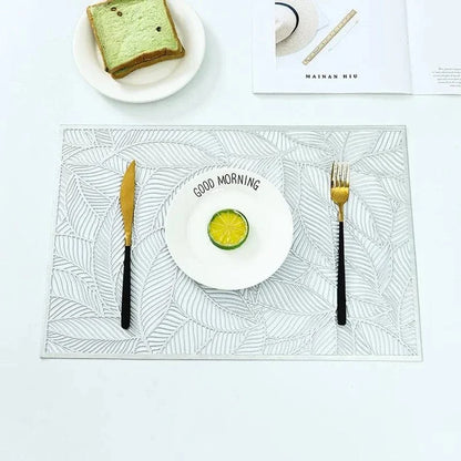 Golden rectangle table mat with hollow leaf design made of PVC and vinyl