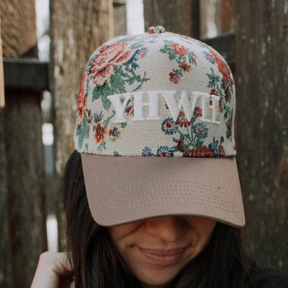 “YHWH Floral Embroidered Hat” – Styled with a Bible and dried florals on a linen background

“Faith-Based Floral Cap with Brown Bill” – Close-up of white embroidery and floral cotton detail